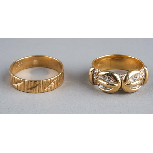 74 - A 9ct yellow gold buckle ring, size N1/2, approx 5.4g; and another 9ct yellow gold ring (split), app... 