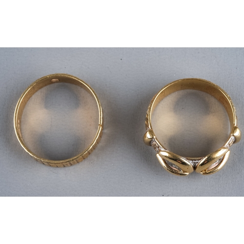 74 - A 9ct yellow gold buckle ring, size N1/2, approx 5.4g; and another 9ct yellow gold ring (split), app... 