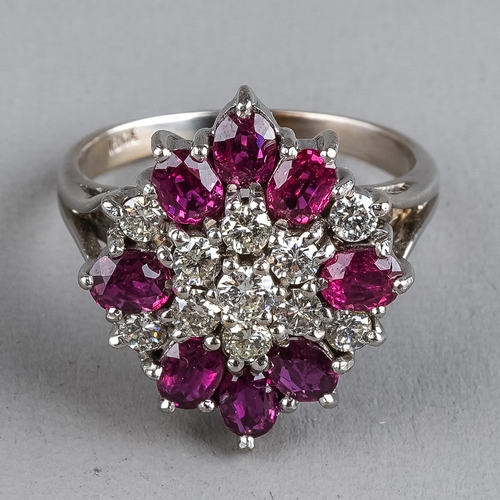 79 - An 18ct white gold diamond and ruby cluster ring, set with eleven round brilliant-cut diamonds and e... 