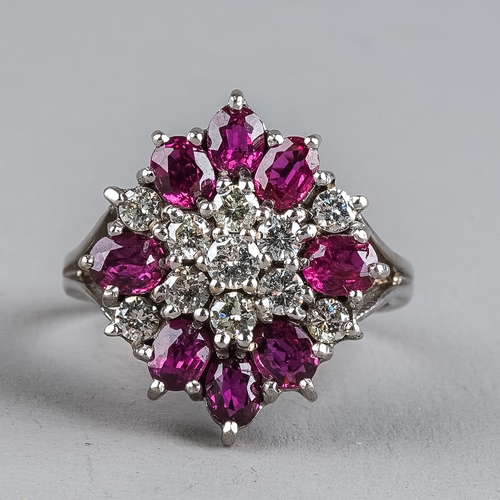 79 - An 18ct white gold diamond and ruby cluster ring, set with eleven round brilliant-cut diamonds and e... 