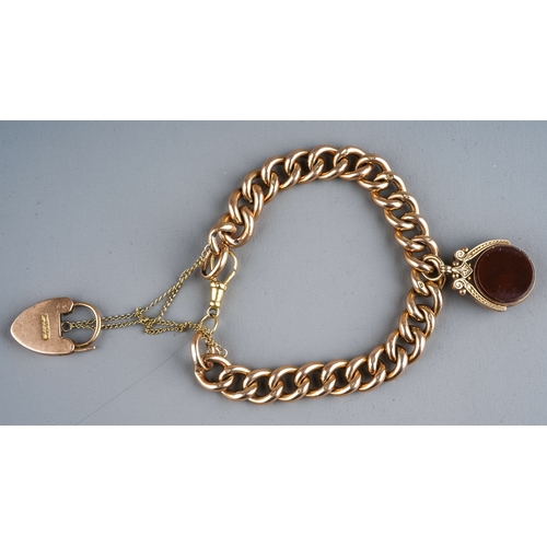 85 - A 9ct gold curb link bracelet, suspending a 9ct gold swivel fob, set with bloodstone and carnelian, ... 