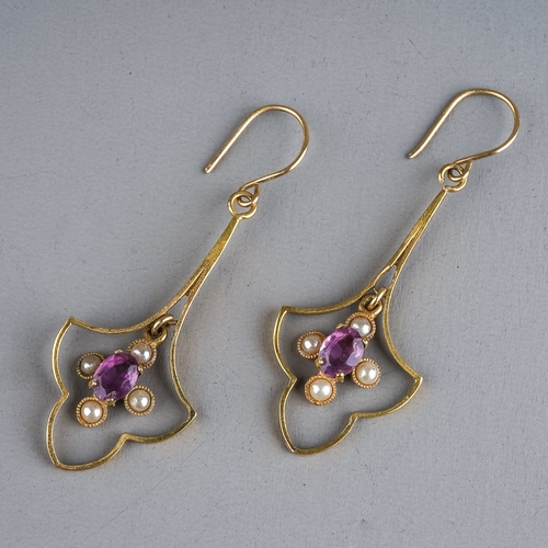 101 - A pair of 9ct gold amethyst and pearl drop earrings, the shaped openwork frame suspending an oval cu... 