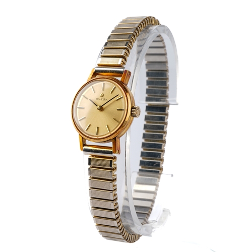 115 - A ladies Omega gold-plated wristwatch, with expanding strap