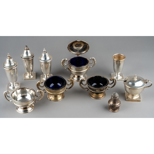 128 - A set of three silver open salts and a mustard pot and cover, Chester 1904, three with blue glass li... 