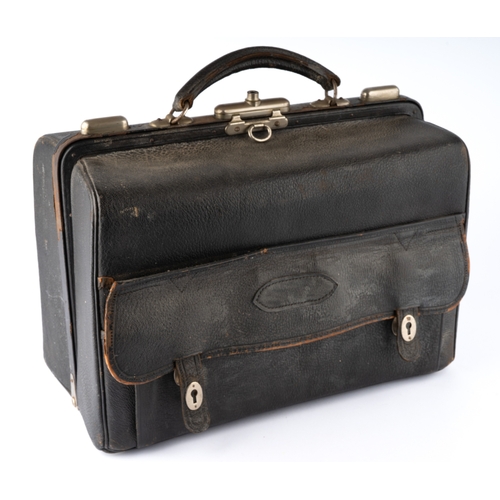 144 - A late Victorian gentleman's leather travelling vanity case enclosing five silver topped dressing ta... 