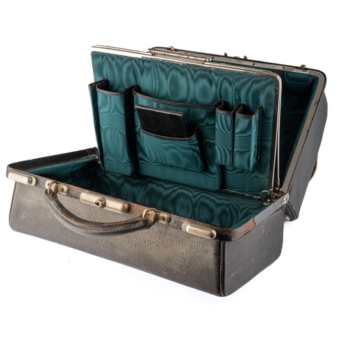 144 - A late Victorian gentleman's leather travelling vanity case enclosing five silver topped dressing ta... 