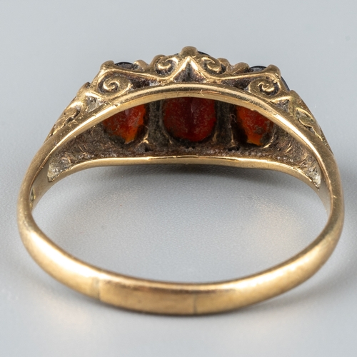 162 - A 9ct yellow gold and garnet dress ring, set with three oval cut stones, ring size O, total gross we... 