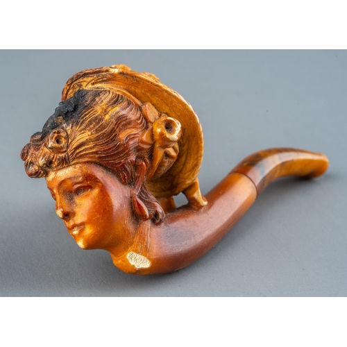 163 - A late 19th/early 20th century Meerschaum pipe, carved as a profile of a lady wearing a bonnet, ambe... 