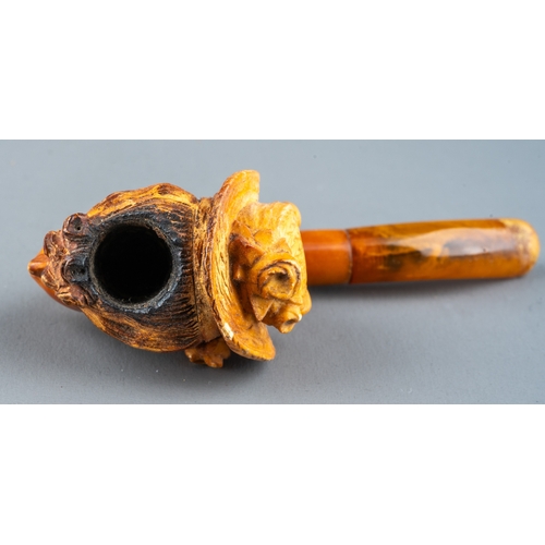 163 - A late 19th/early 20th century Meerschaum pipe, carved as a profile of a lady wearing a bonnet, ambe... 