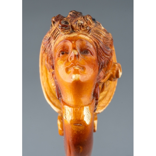 163 - A late 19th/early 20th century Meerschaum pipe, carved as a profile of a lady wearing a bonnet, ambe... 