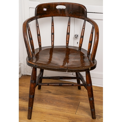 168 - A late 19th Century oak captain's chair, with pierced splat, spindle back, shaped seat and turned fr... 