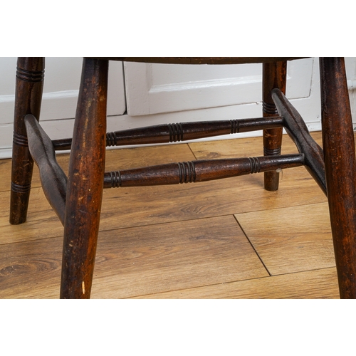 168 - A late 19th Century oak captain's chair, with pierced splat, spindle back, shaped seat and turned fr... 