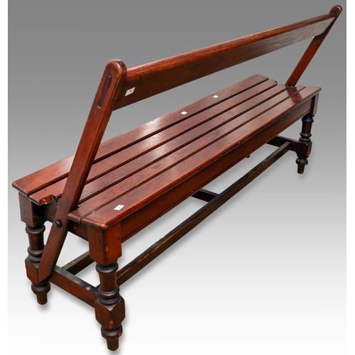 170 - An early 20th Century slatted wood tram bench with reversible back rest, on turned supports, 152cm l... 