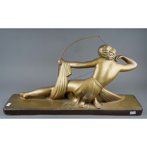 178 - After Salvatore Melani, an Art Deco style large gilt plaster model depicting a Goddess with bow on p... 