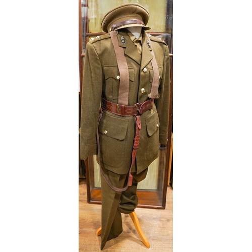 228 - A post 1953 Royal Engineers uniform comprising: trousers, jacket, shirt, cap badges and Sam Brown be... 