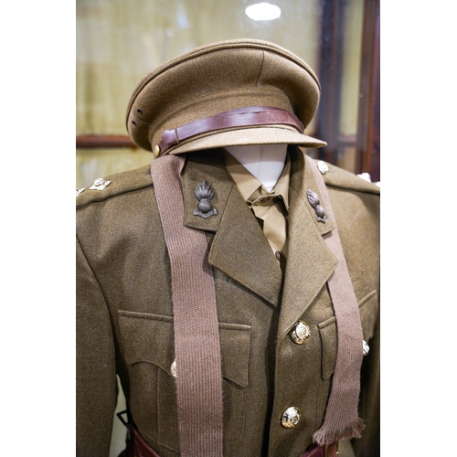 228 - A post 1953 Royal Engineers uniform comprising: trousers, jacket, shirt, cap badges and Sam Brown be... 