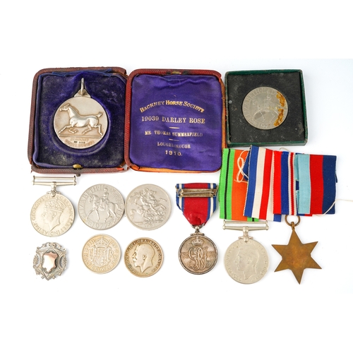 231 - A World War II trio of medals, unnamed; a George V and Queen Mary 1910-1935 Jubilee medal; a silver ... 