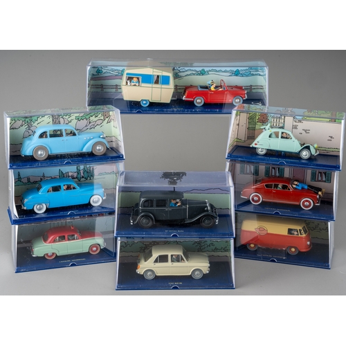 240 - A collection of Tintin Herge Moulinsart die cast models, all in perspex case with background design ... 