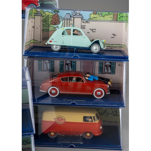 240 - A collection of Tintin Herge Moulinsart die cast models, all in perspex case with background design ... 