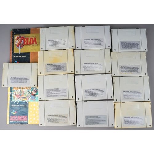 267 - An assortment of twelve loose Super Nintendo (SNES) cartridges, games to include: The Legend of Zeld... 