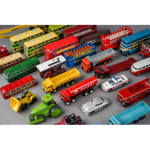 288 - A large assorted collection of vintage die cast models of dinky cars, buses, trucks, tractors makes ... 