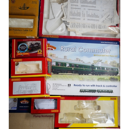 297 - Two boxes of assorted model railway kit buildings to include: houses, factories, stations, bridges, ... 