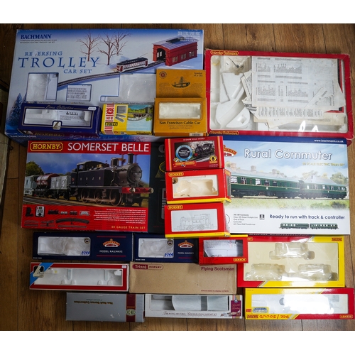 297 - Two boxes of assorted model railway kit buildings to include: houses, factories, stations, bridges, ... 