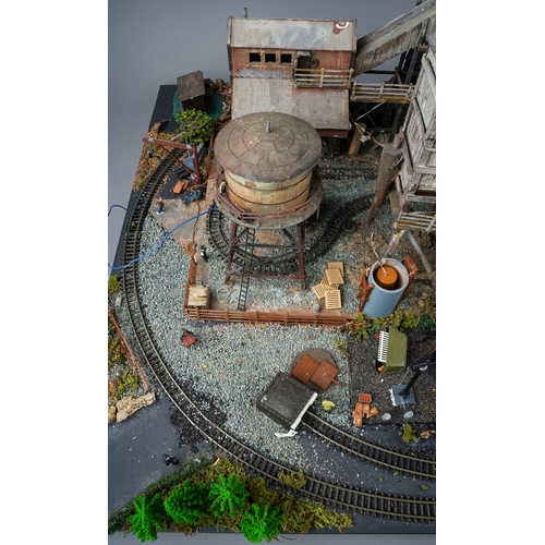 298 - A model railway N gauge layout board containing diorama depicting coal mine processing plant with fi... 