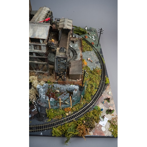 298 - A model railway N gauge layout board containing diorama depicting coal mine processing plant with fi... 