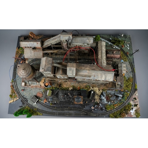 298 - A model railway N gauge layout board containing diorama depicting coal mine processing plant with fi... 