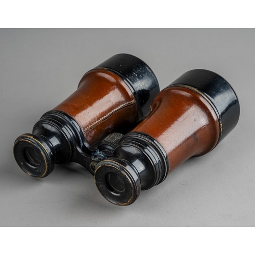 316 - A pair of vintage binoculars, with fitted leather case