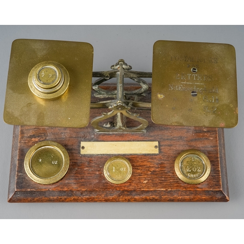 354 - A pair of vintage postal scales with various weights