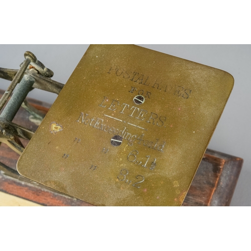 354 - A pair of vintage postal scales with various weights