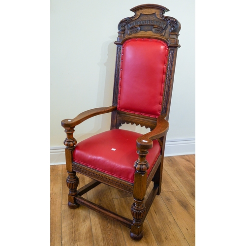 363 - A Gothic style carved oak throne chair, red leather seat and backing, with carved lettering on the h... 