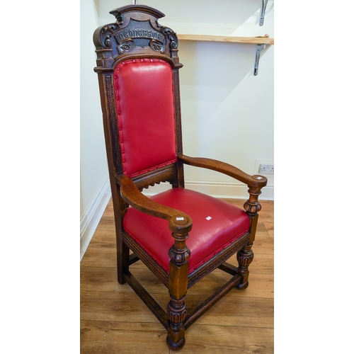 363 - A Gothic style carved oak throne chair, red leather seat and backing, with carved lettering on the h... 