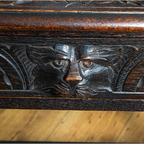 385 - A 17th Century style painted oak side table, the rectangular top with incised sunbeam decoration on ... 