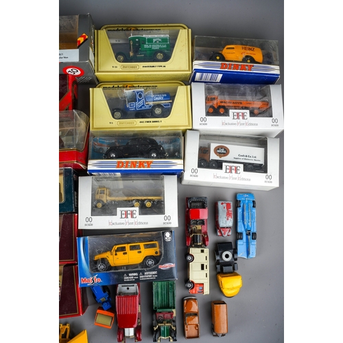 387 - A collection of boxed and loose die cast models of cars, vans, trucks, makers to include: Dinky Matc... 