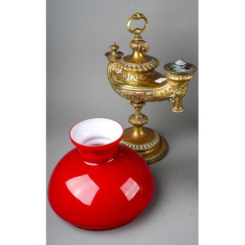 399 - A matched pair of German Wild & Wessel 1373 Aladdin style brass table lamps, with red over white gla... 