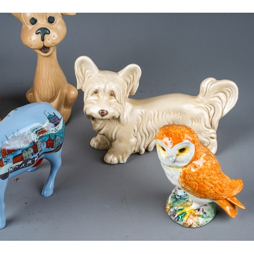 401 - A collection of ceramic animals to include: John Beswick Jersey cow; Beswick Owl, Modern Lowry Cow a... 