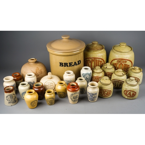 403 - A collection of earthenware to include: Victorian style cream jars with transfer printed labels,, al... 