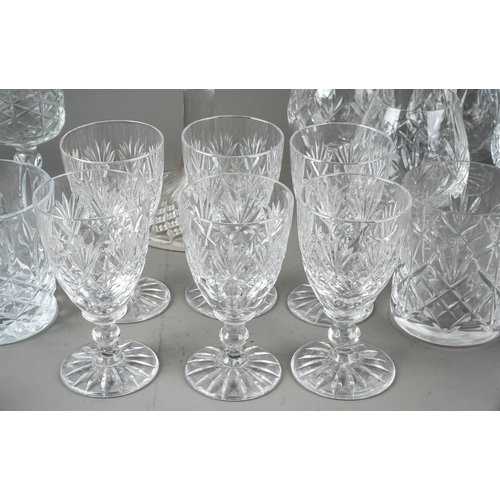 407 - A collection of glassware to include decanters, candlesticks, blue glass brandy glass, cruet set wit... 