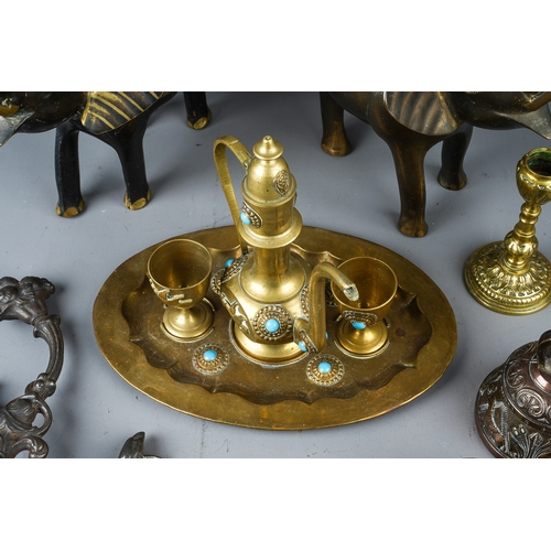 408 - A collection of brass and copperware to include: Middle Eastern tea set with pair of cups, kettle an... 