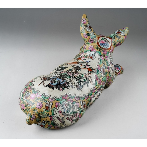 432 - A Japanese porcelain pig, the body decorated with vignettes depicting vase of flowers and birds, the... 