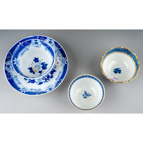 447 - An 18th Century blue and white tea bowl, decorated with chrysanthemums under trees, floral sprig to ... 