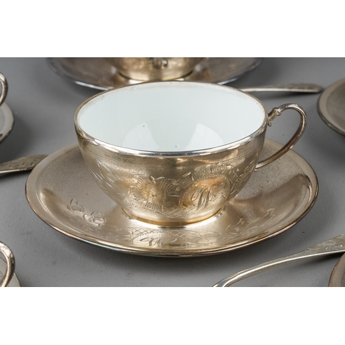 452 - A set of six Continental white metal mounted ceramic coffee cups with matching white metal saucers a... 