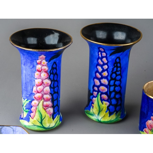 453 - A collection of very rare Carlton Ware 1928 'New Delphinium' pattern, to include candle holder, appr... 