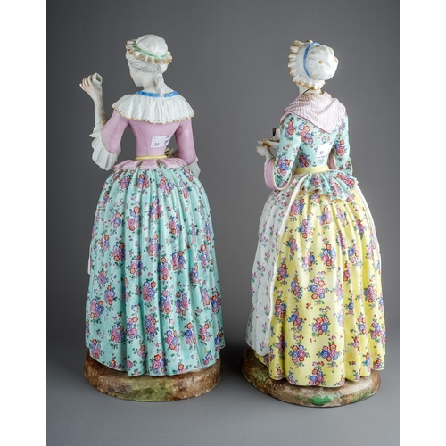 472 - Two 19th century very large Meissen figures, depicting ladies in floral dresses, with crossed swords... 