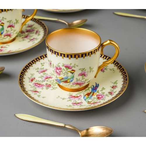 512 - A set of six Royal Worcester Chinoiserie coffee cups and saucers, on ivory ground decorated with a p... 