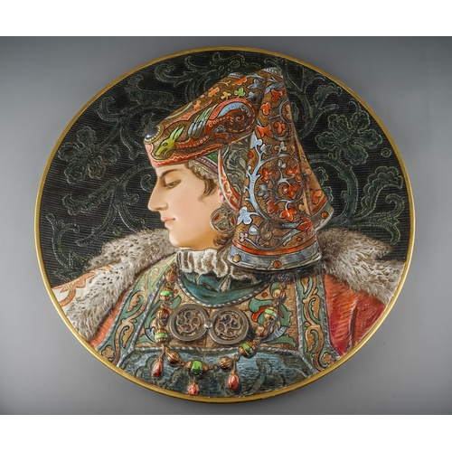 513 - A pair of late 19th Century large circular portrait plaques, each moulded and decorated with Persian... 