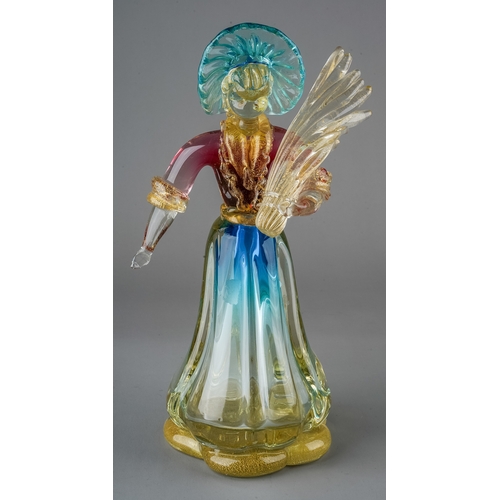 517 - A Murano glass figure of a lady wearing bonnet and carrying bread, in clear with gold powders and bl... 